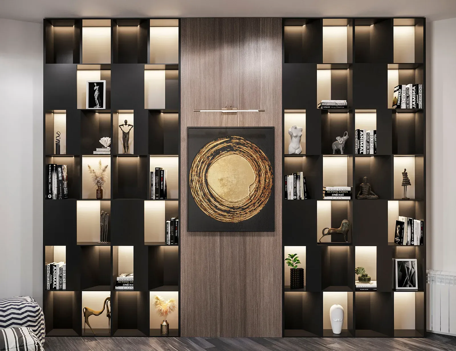 A floor-to-ceiling shelving wall of black open niches, each one backlit, split either side of a central wood-veneer panel carrying a framed artwork under a picture light.